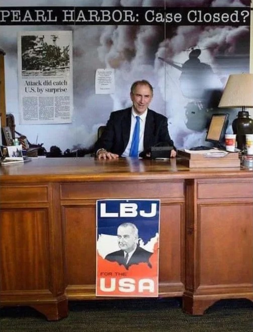 Patrick D. Weadon behind the desk